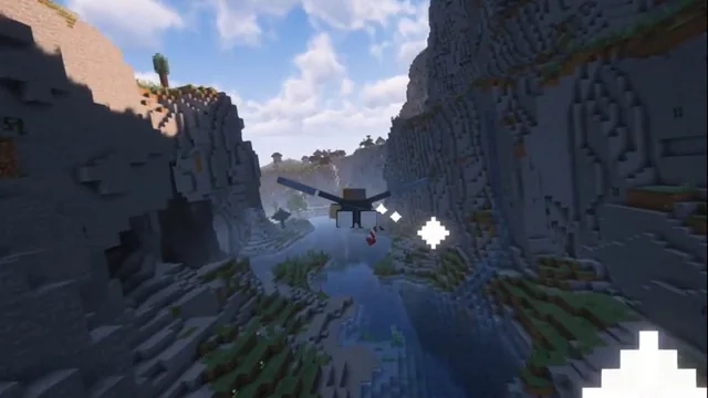 Minecraft elytra flight through a mountain canyon