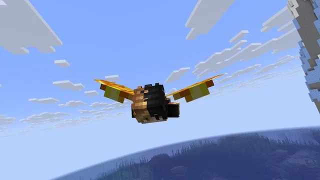 Minecraft player gliding with elytra above the ocean